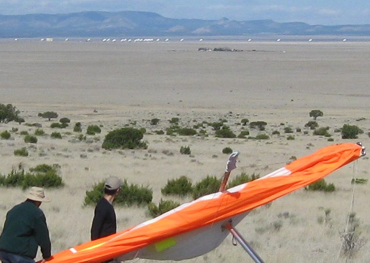 VLA dishes swing and catch the sun..PNG